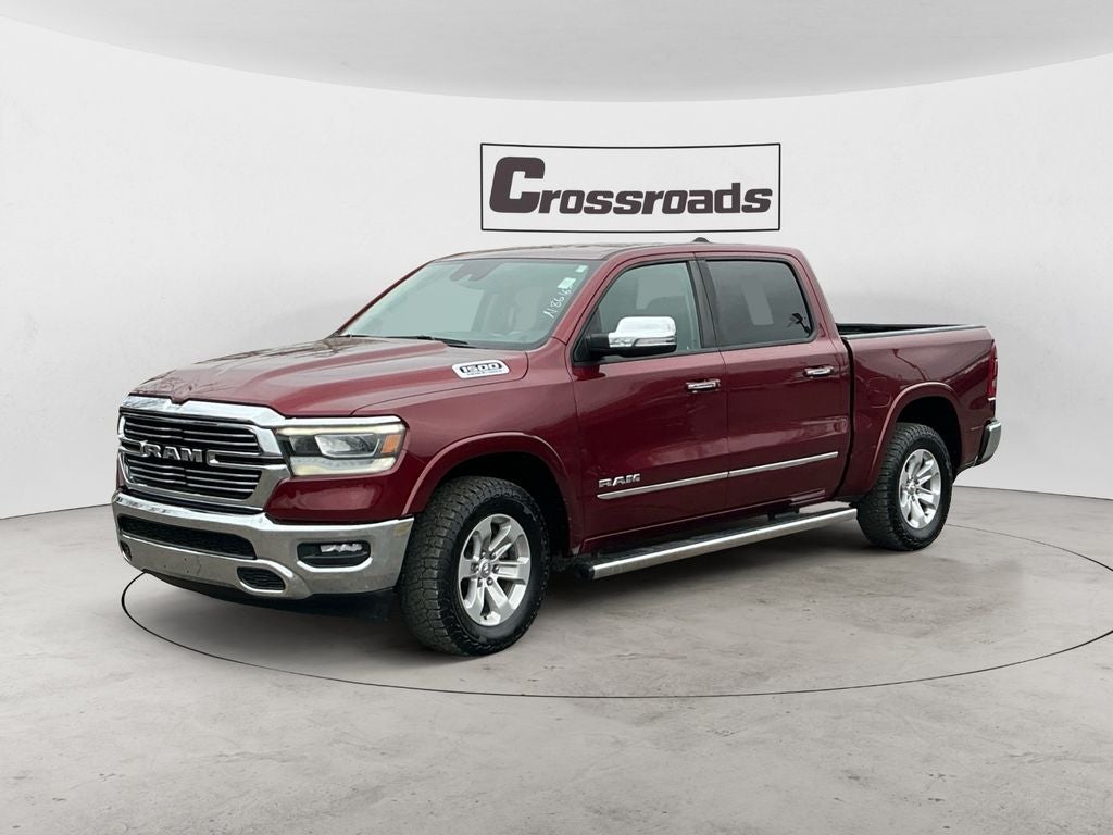2021 RAM 1500 Laramie in Delmonico Red Pea — front three-quarter view