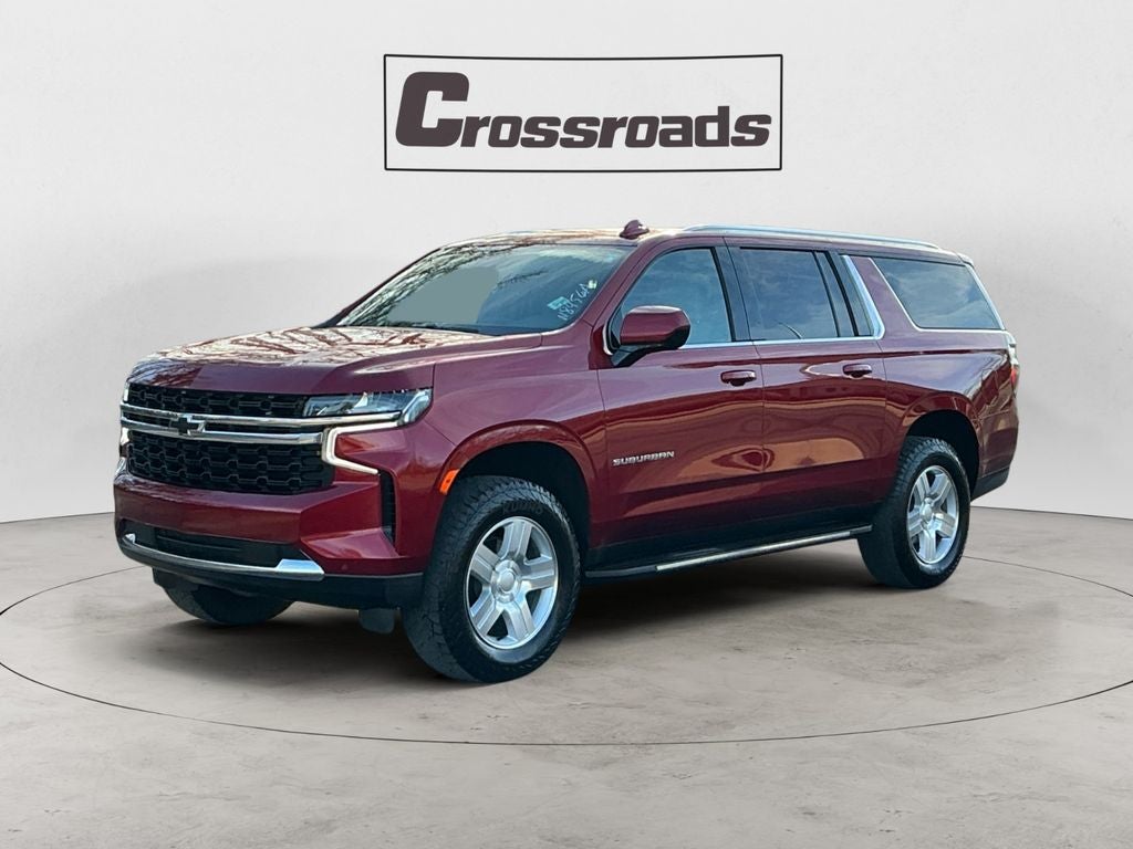 2023 Chevrolet Suburban LS in Radiant Red Tintcoat — front three-quarter view