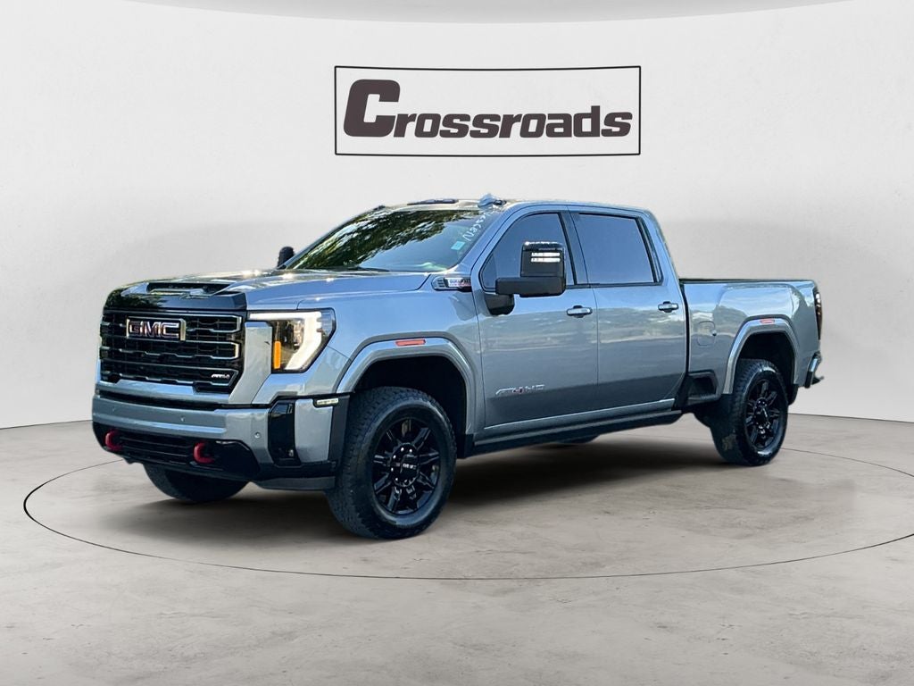 2026 GMC Sierra 2500 HD AT4 in Sterling Metallic — front three-quarter view