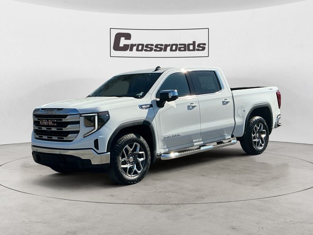 2026 GMC Sierra 1500 SLE in Summit White — front three-quarter view